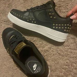 Nike black and gold star studded Air Force ones